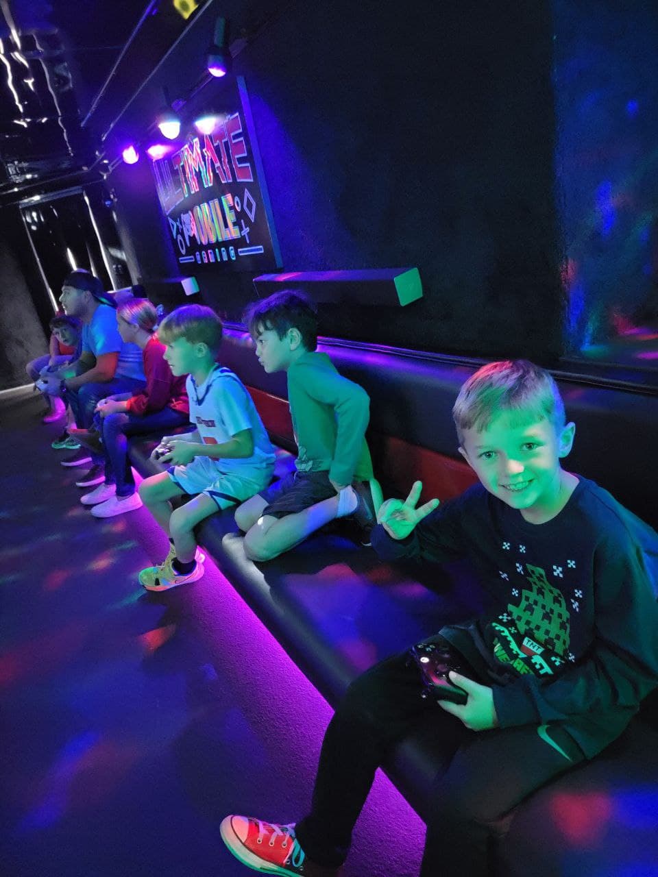 Guests playing on the screens inside the climate-controlled trailer
