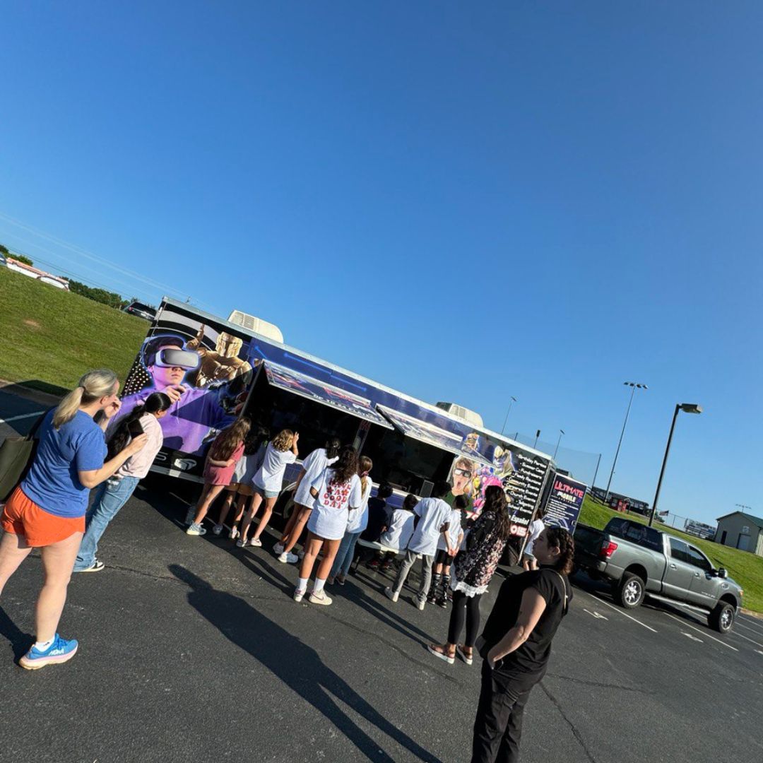 Game Truck Experience in Alpharetta, GA: A fully equipped mobile gaming truck parked at a birthday party.