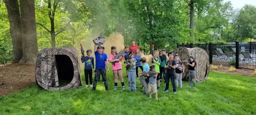 kids taking a group photo for the nerf battle royale weekend rental