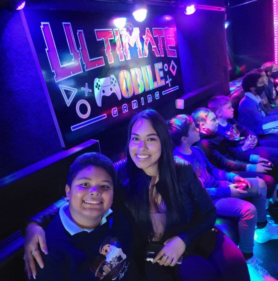 Mother and son celebrating at a mobile gaming party