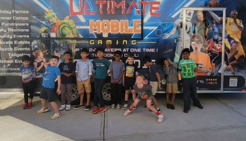 Kids at a 9 year old birthday party in Atlanta playing video games