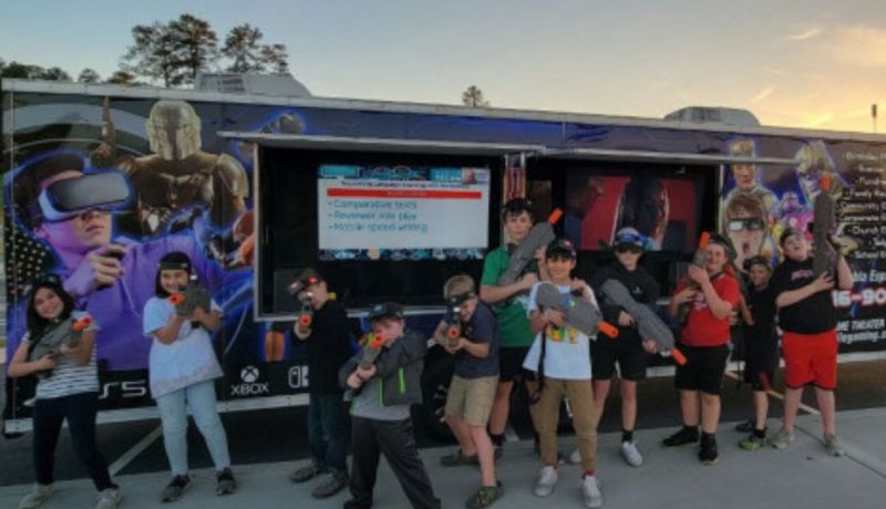Birthday party game truck setup with consoles