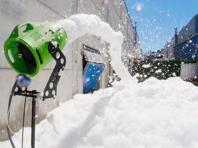 Foam party Green foam cannon generating a massive pile of white foam